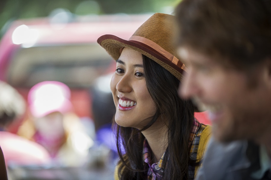 20-something girl wearing hat and smiling
