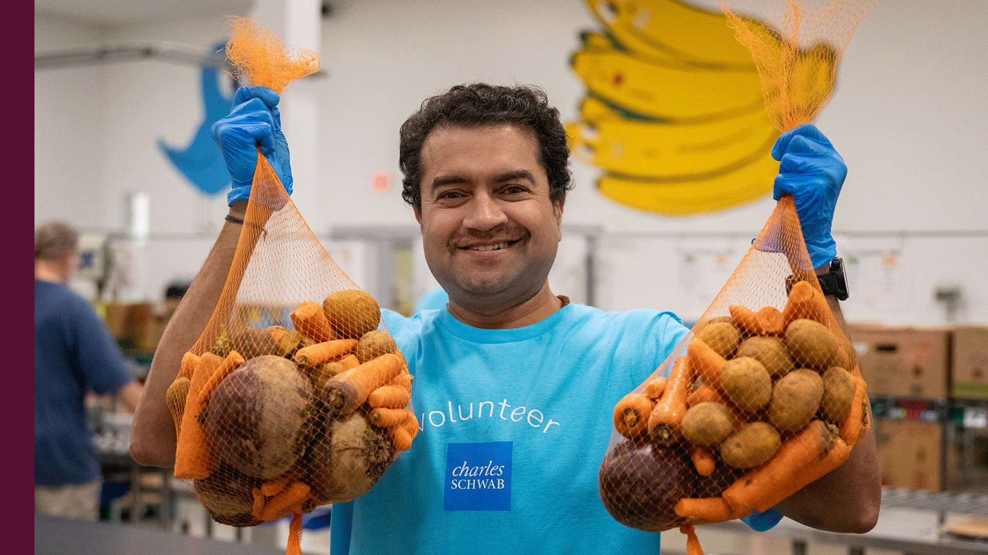 Schwab employee volunteering at a local food bank