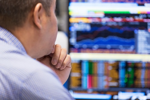 Trader looking at computer monitors