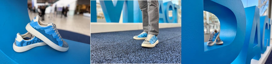 A series of three pictures. The first shows a close, up of light blue shoes painted with a mountain scene propped inside an oversized letter P. The second shows a close up of man's feet wearing the shoes in front of the IMPACT sign, and you can see that the word Schwab is painted on the front of one shoe. . And the third is another picture of the shoes in the P, but at another angle further away.