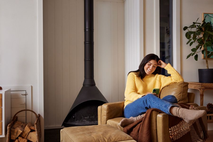 woman relaxing on chair in living room