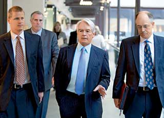 Jonathan Craig, Chuck Schwab and Greg Gable in a discussion while walking.