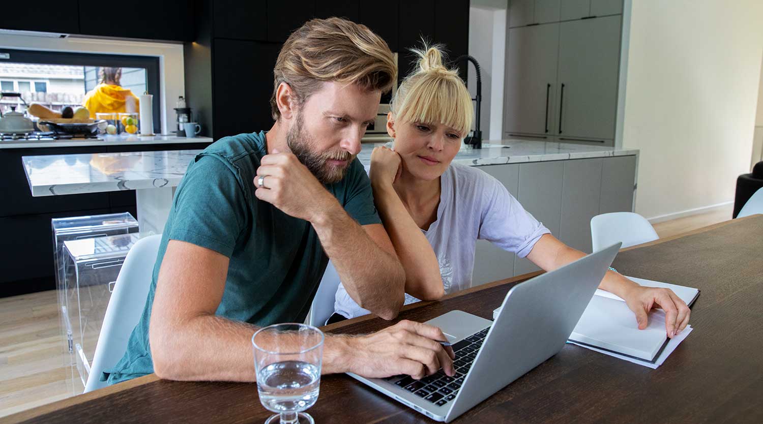 Couple looking over their finances.