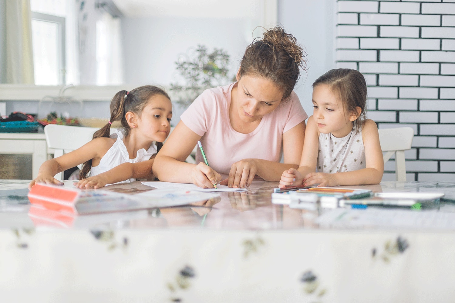 A mother and her children doing activities.