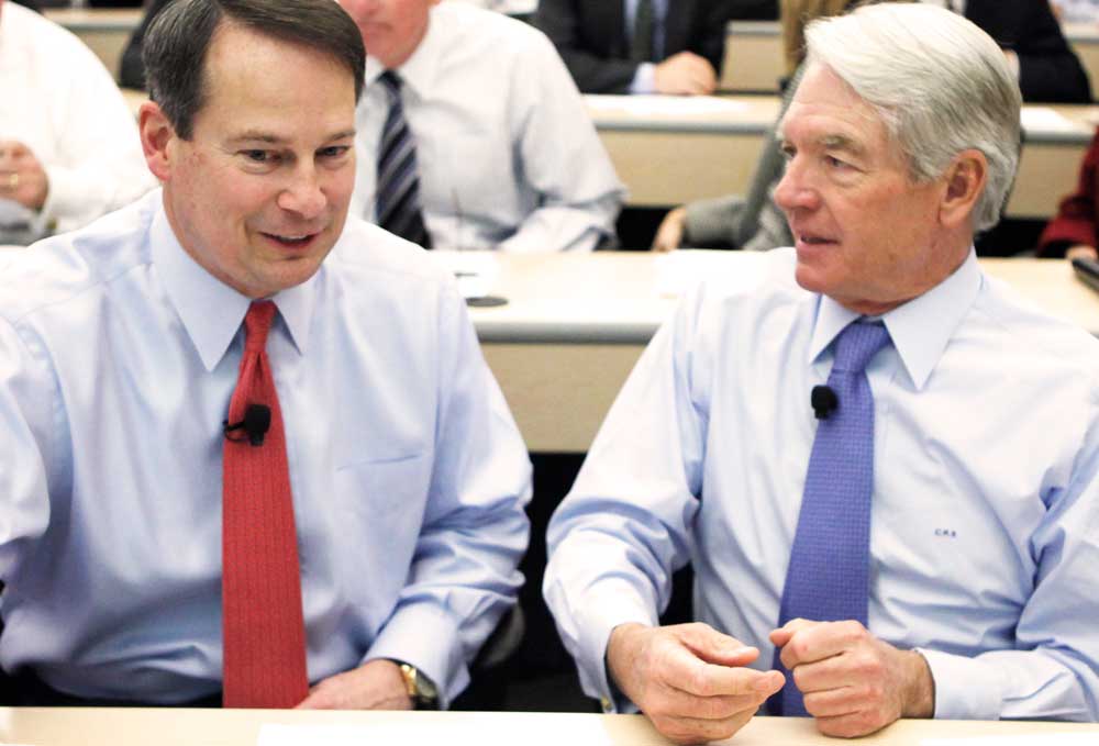 Walt Bettinger and Chuck Schwab in a discussion.