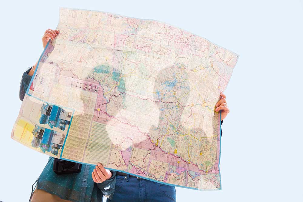 Individuals looking at a map.