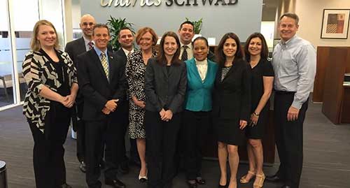 Walt Bettinger, CEO (right) with a group of employees.