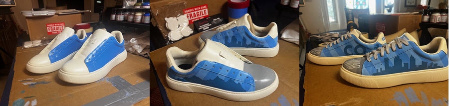 A series of three photos showing a white pair of shoes being custom painted. The first photo shows the white shoes with a light blue color added to the sides. The second shows gray added to the top of the shoes and a mountain scene added to the blue sides. The rhird shows the final product which is a fully custom pair of shoes with light and dark blue stripes, a city skyline, the letters CO and the words Charles Schwab partially displayed on the toes of the shoes.