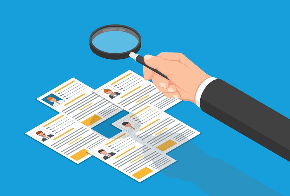 Graphic of a magnifying glass looking at employee profiles.