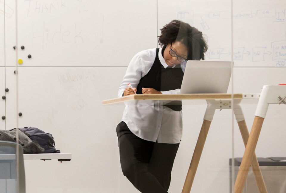 Woman working at a stand-up desk