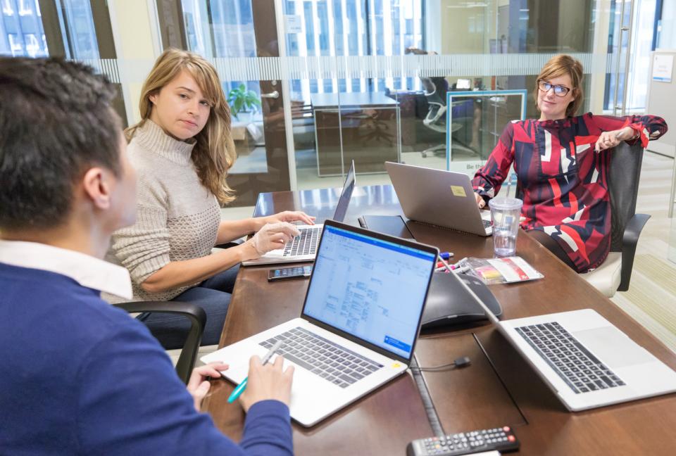 People seated at a desk