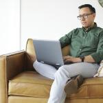 a man looking at his computer